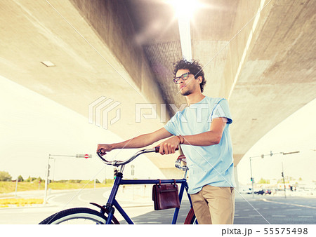 hipster man with fixed gear bike under bridge 55575498