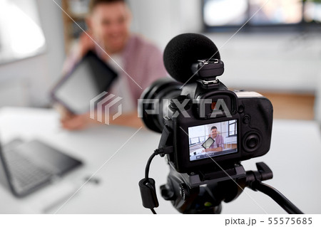 camera recording video blogger with tablet pc 55575685