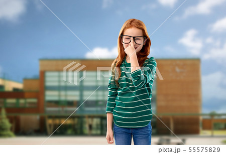 red haired student girl in glasses over school red haired student girl in glasses over school 55575829