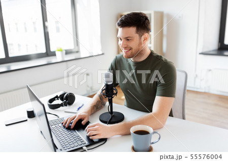 blogger with laptop and microphone audio blogging 55576004