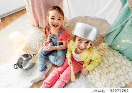 girls with pots playing in kids tent at home girls with pots playing in kids tent at home 55576265