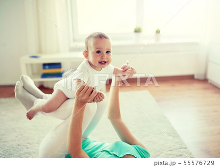 happy mother playing with baby at home happy mother playing with baby at home 55576729