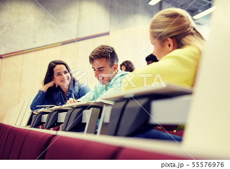 group of students with notebooks at lecture hall group of students with notebooks at lecture hall 55576976