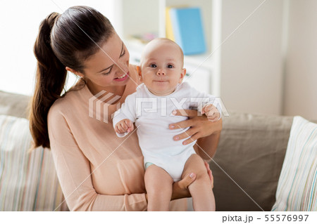 happy mother with little baby boy at home 55576997