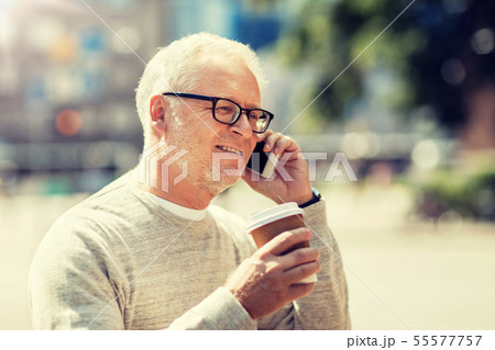happy senior man calling on smartphone in city happy senior man calling on smartphone in city 55577757