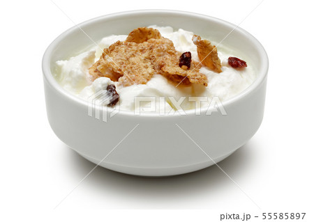 Cereal and yoghurt in bowl isolated on white Cereal and yoghurt in bowl isolated on white 55585897
