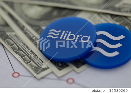 Libra blue cryptocyrrency coin lie on table 55589269