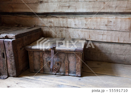 Old wooden chest on floor 55591710