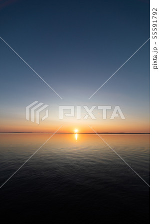Calm serene sunrise lake scenery Calm serene sunrise lake scenery 55591792