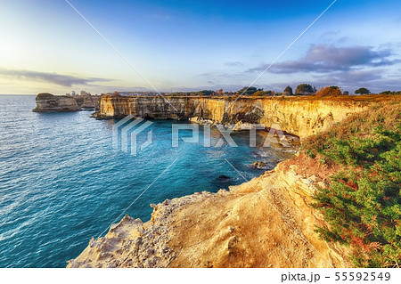 Picturesque seascape with cliffs rocky arch and Picturesque seascape with cliffs rocky arch and 55592549