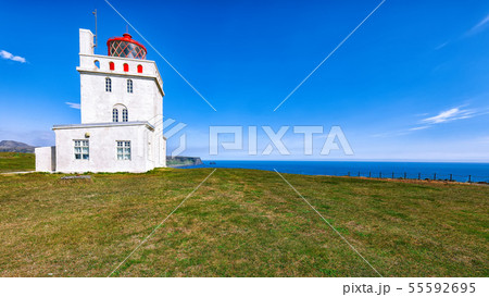 Landscape with white lighthouse at Cape Dyrholaey 55592695
