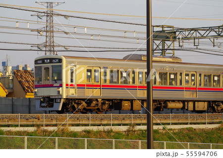 夕暮の多摩川橋梁を通過する京王線 55594706