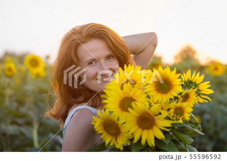 Girl and sunflowers Girl and sunflowers 55596592
