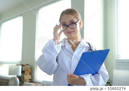 Young pretty woman doctor in glasses Young pretty woman doctor in glasses 55603274
