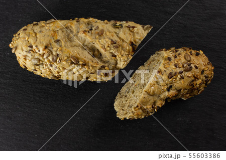 Fresh cereal baguette on grey stone 55603386