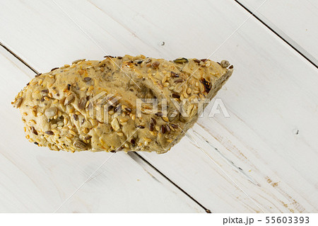 Fresh cereal baguette on grey wood Fresh cereal baguette on grey wood 55603393