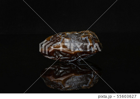 Dried date medjool isolated on black glass 55603627