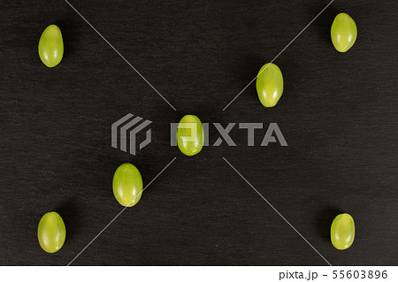 Fresh green grape on grey stone Fresh green grape on grey stone 55603896