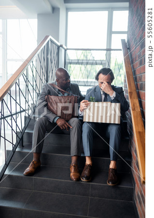 Businessman feeling awful after been redundant from the office 55605281