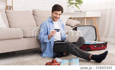 Man booking tour online, preparing for vacation Man booking tour online, preparing for vacation 55605345