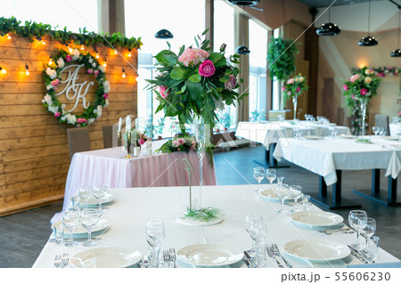 Beautiful table setting with crockery and flower 55606230