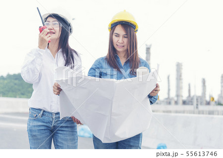 Civil Engineer Team holding blueprint plan for 55613746