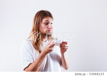 Man with hygienic tissue 55668125