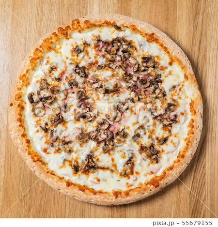 italian pizza on the wooden background italian pizza on the wooden background 55679155