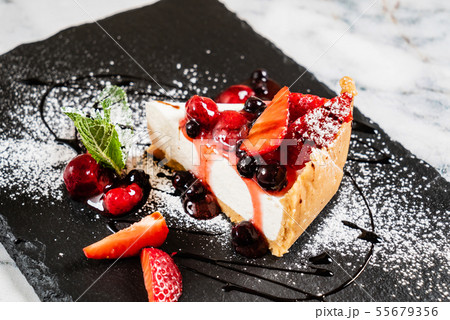 cheesecake with fresh strawberries and mint 55679356