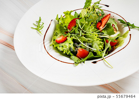 healthy salad with strawberriesa and arugula healthy salad with strawberriesa and arugula 55679464