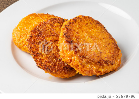 carrot pancakes on the white plate 55679796