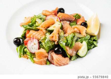 salad with smoked salmon on the white plate salad with smoked salmon on the white plate 55679840
