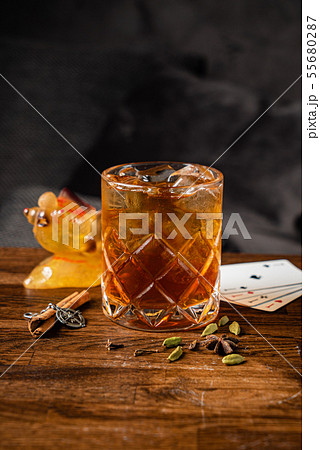 cocktail with cinnamon and cardamom 55680287