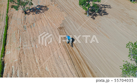 Top view of agricultural tractor vehicles working Top view of agricultural tractor vehicles working 55704035