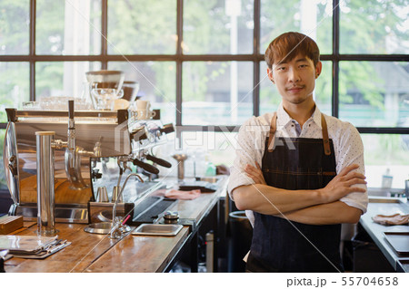 Portrait Asian barista at work in coffee shop Portrait Asian barista at work in coffee shop 55704658