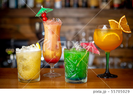 Multi-colored refreshing cocktails at the bar. Close up 55705029