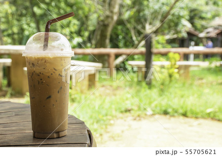 Iced coffee in glass on the table Background grass Iced coffee in glass on the table Background grass 55705621