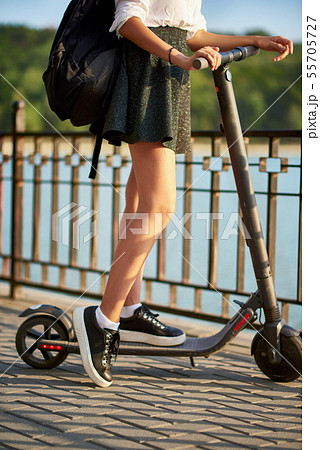 Teen high school girl with electric scooter near Teen high school girl with electric scooter near 55705727