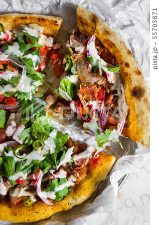 Lahmajong with roasted vegetables and feta. 55705871