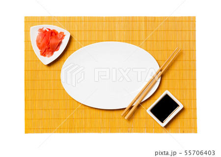 Empty oval white plate with chopsticks for sushi 55706403