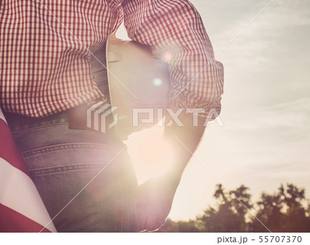 Young engineer, white hardhat and American Flag Young engineer, white hardhat and American Flag 55707370