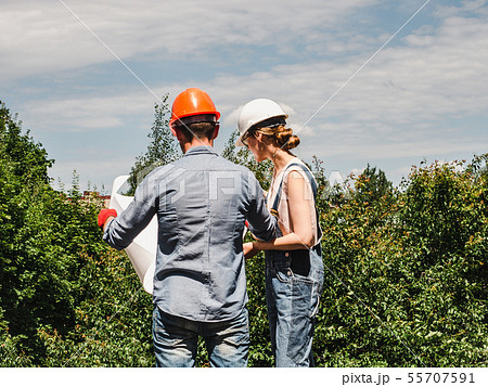 Young engineer woman and her subordinate worker Young engineer woman and her subordinate worker 55707591