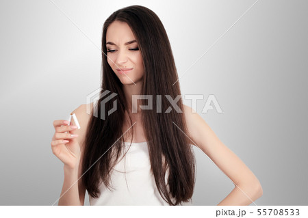 happy young beautiful woman holding a broken cigarette,quit smoking concept happy young beautiful woman holding a broken cigarette,quit smoking concept 55708533