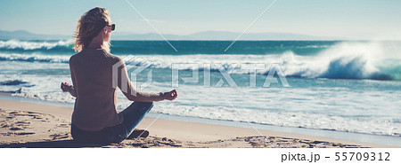Horizontal image woman do yoga near sea 55709312