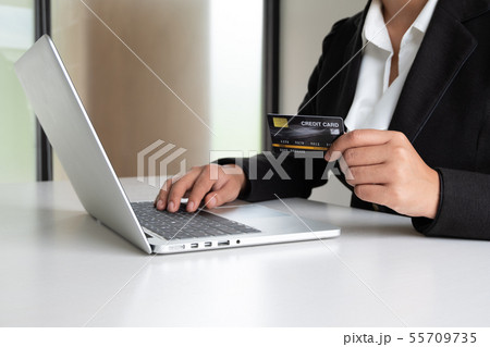 Business woman consumer holding credit card 55709735