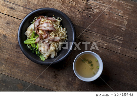 Traditional Thai egg noodles on wooden table top 55710442