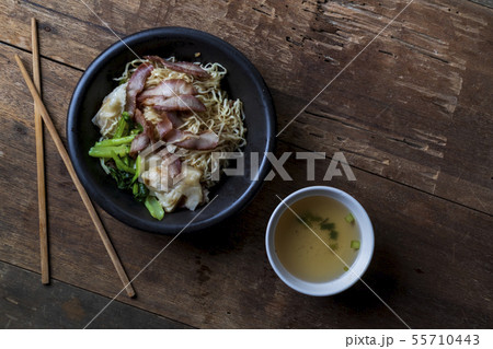 Traditional Thai egg noodles on wooden table top Traditional Thai egg noodles on wooden table top 55710443
