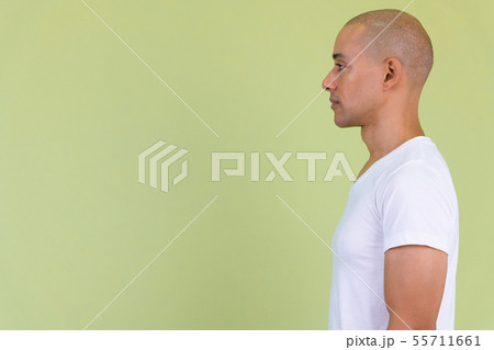 Profile view of handsome bald man with mixed race Profile view of handsome bald man with mixed race 55711661