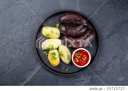Spanish and Argentine MORCILLA blood sausages with potatoes and chile sauce Spanish and Argentine MORCILLA blood sausages with potatoes and chile sauce 55715727