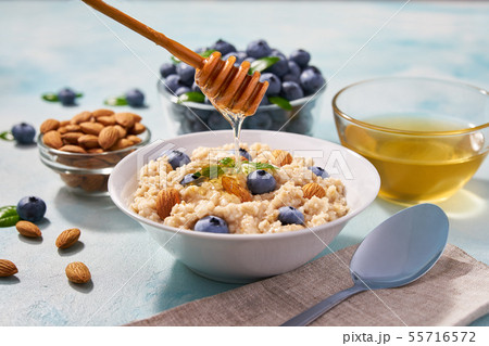 Homemade oatmeal with  fresh blueberry and organic 55716572